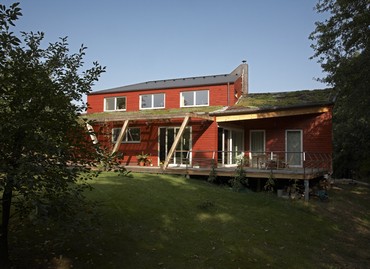 View from the garden on the residential terrace, left are the sliding door to the dining room, right doors into parents